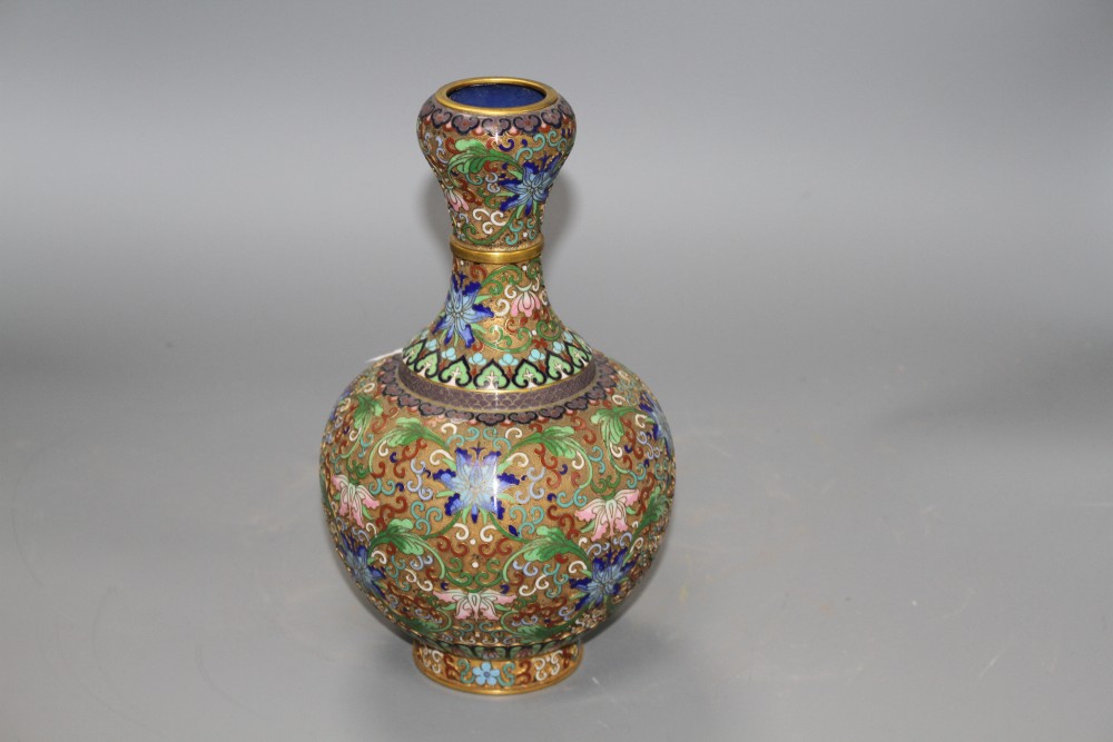 A Chinese champleve enamelled gilt brass vase, decorated with flowers, height 23cm